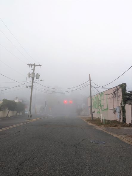 very foggy intersection