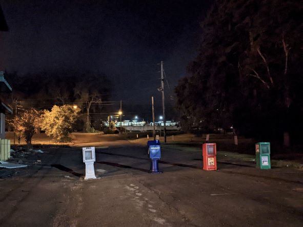 magazine vending machines all lined up like roadblocks