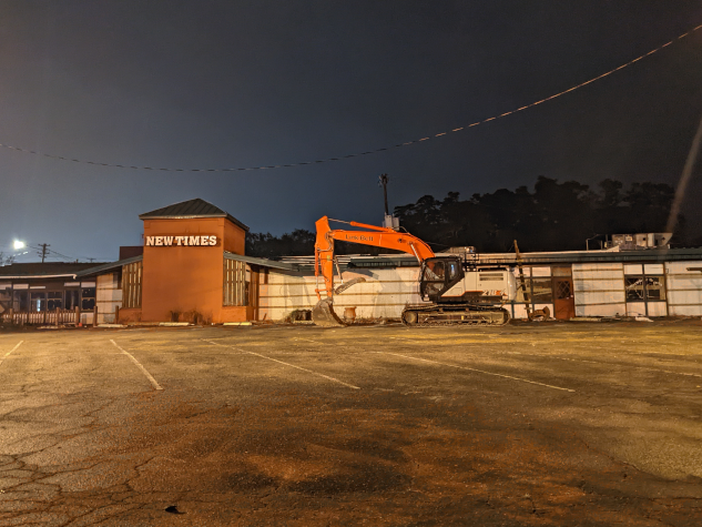 photo of new times country buffet with a bulldozer in the parking lot