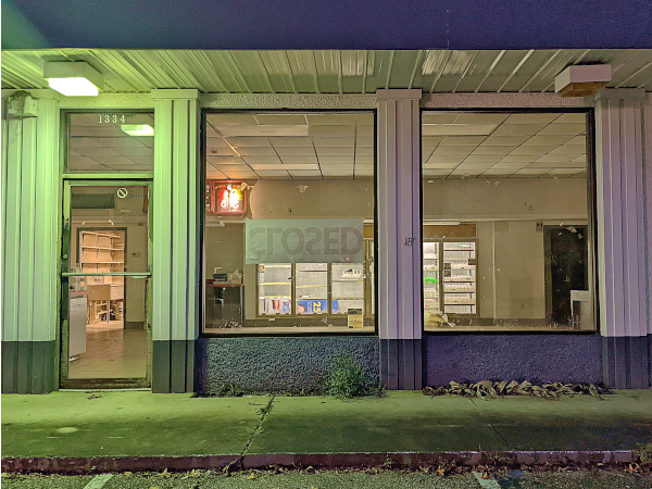 outside looking in on the old Shell station convenience store - very empty!